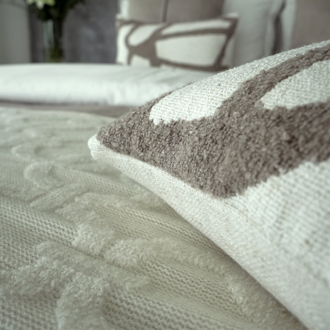 BEACON Zola bedding set with floral patterns in soft pastel colors, displayed on a neatly made bed.