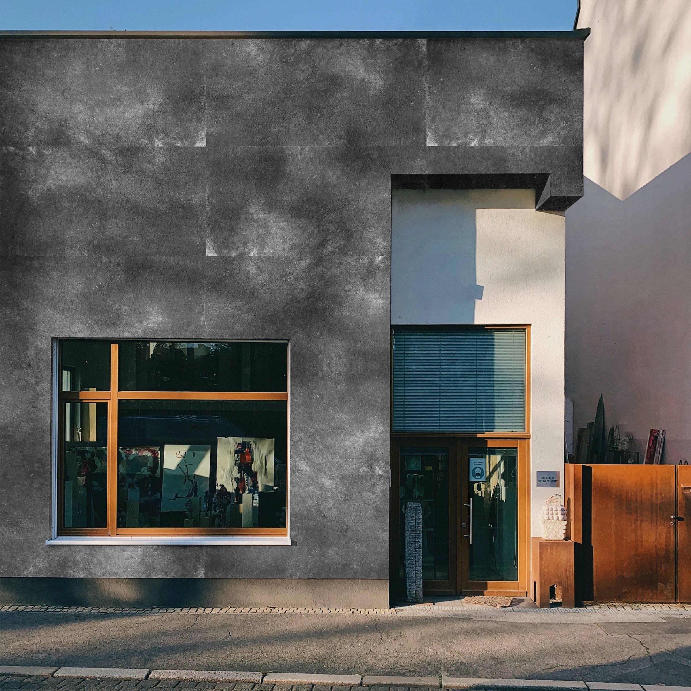 Dark grey Flex Stone Cladding wall panel by BEACON, 120x60cm, with textured cement finish for modern interior or exterior walls.