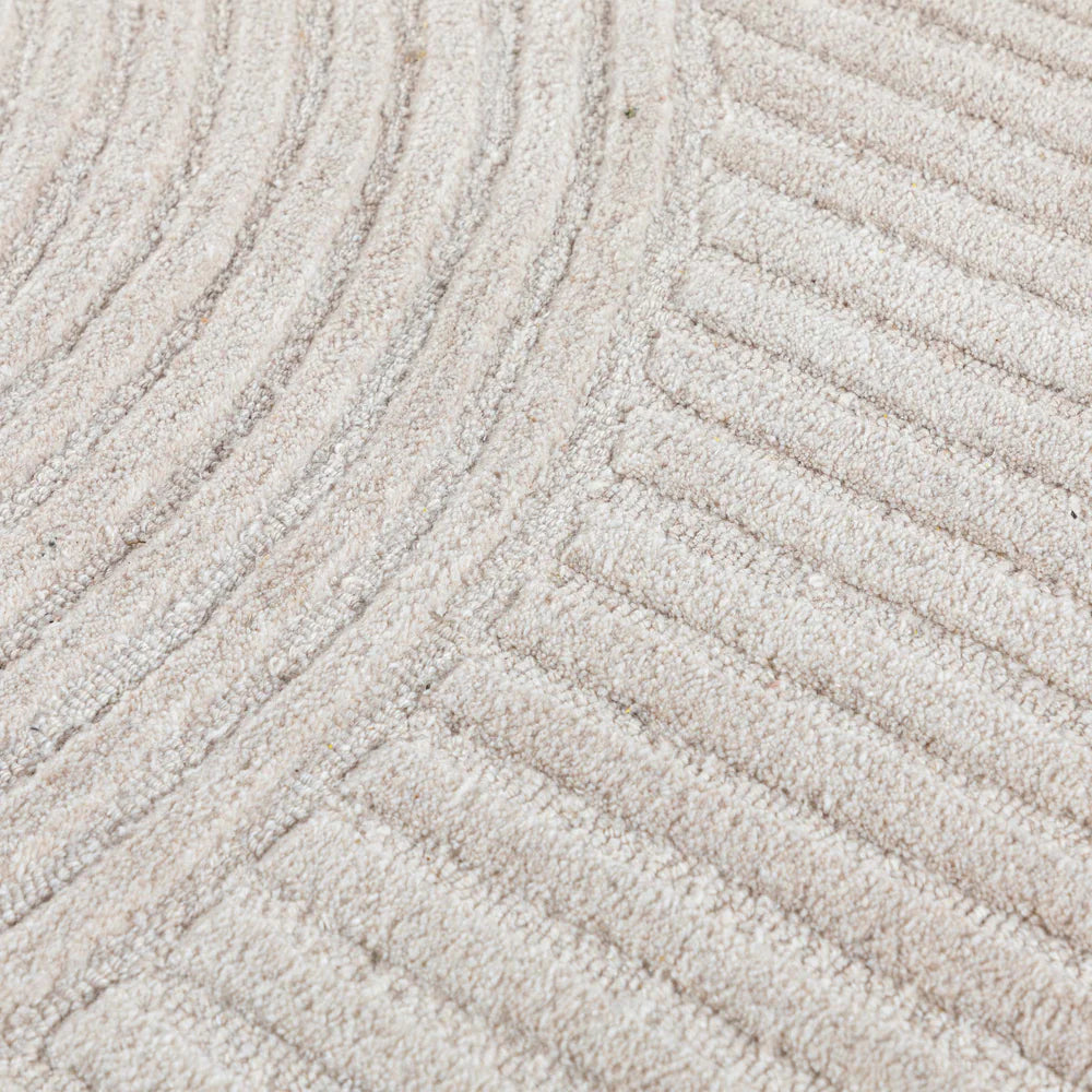 180x120 cm wool rug by Javi, featuring a soft textured surface and intricate pattern in neutral tones.