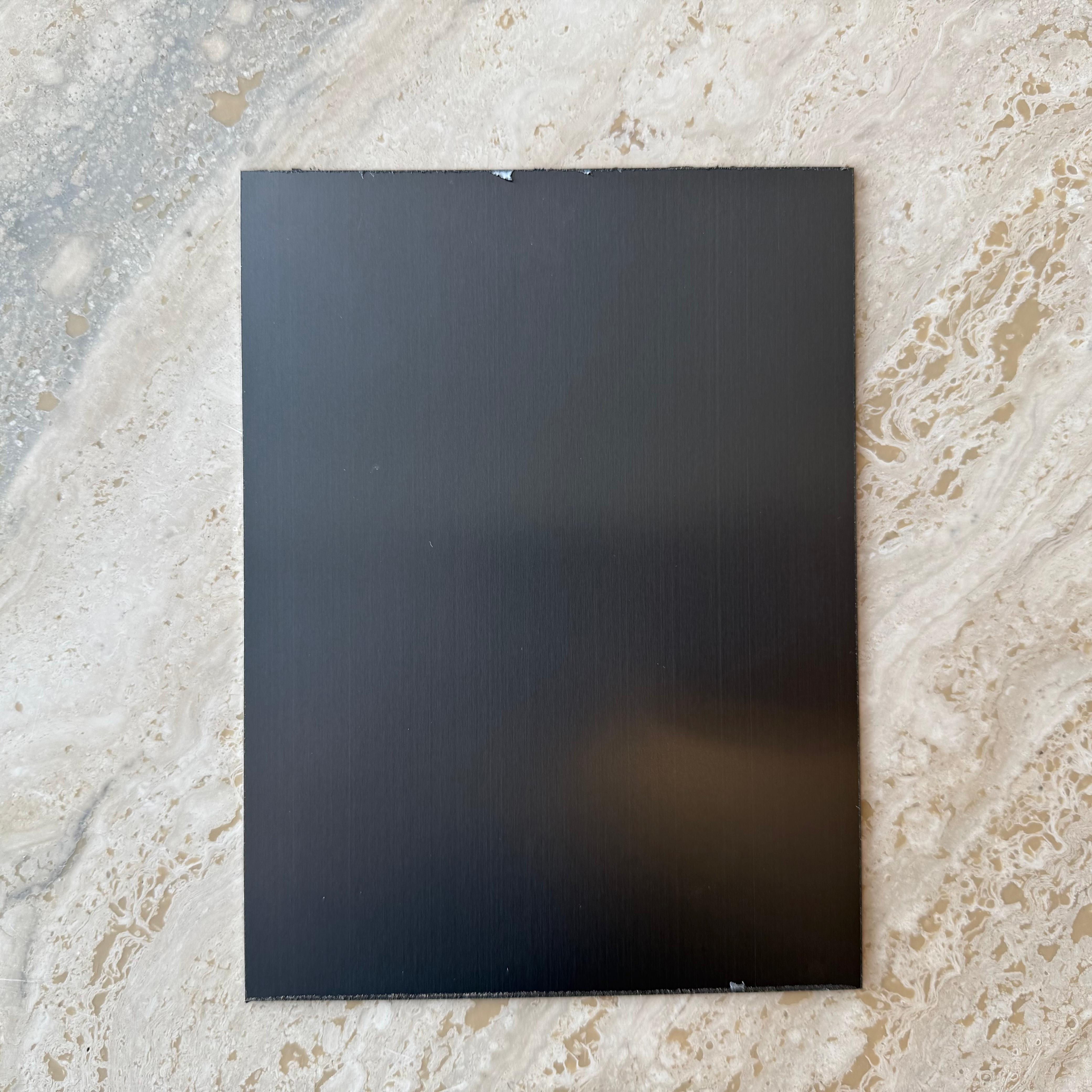 Black 1mm stainless steel profile wall panel, 15cm long, by BEACON, ideal for modern interior or exterior wall cladding.