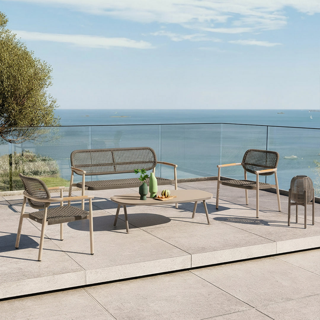 Outdoor lounge armchair by Beacon with woven rope details, designed for comfortable outdoor relaxation.