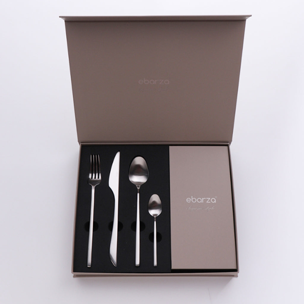 Set of 24-piece BEACON Viva Cutlery Set 9002 including forks, knives, and spoons arranged on a table.