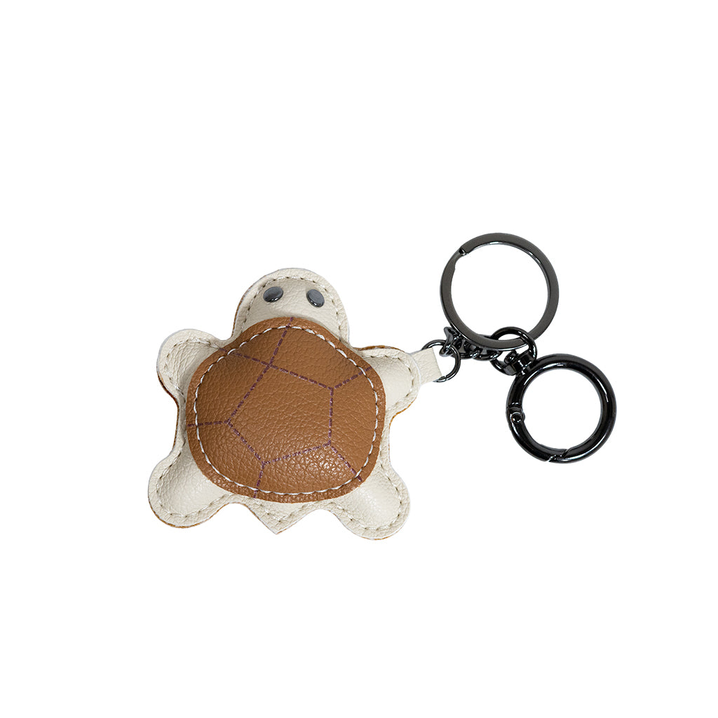 BEACON keychain numbered 003 with a metal loop and decorative charm, ideal for keys or accessories.
