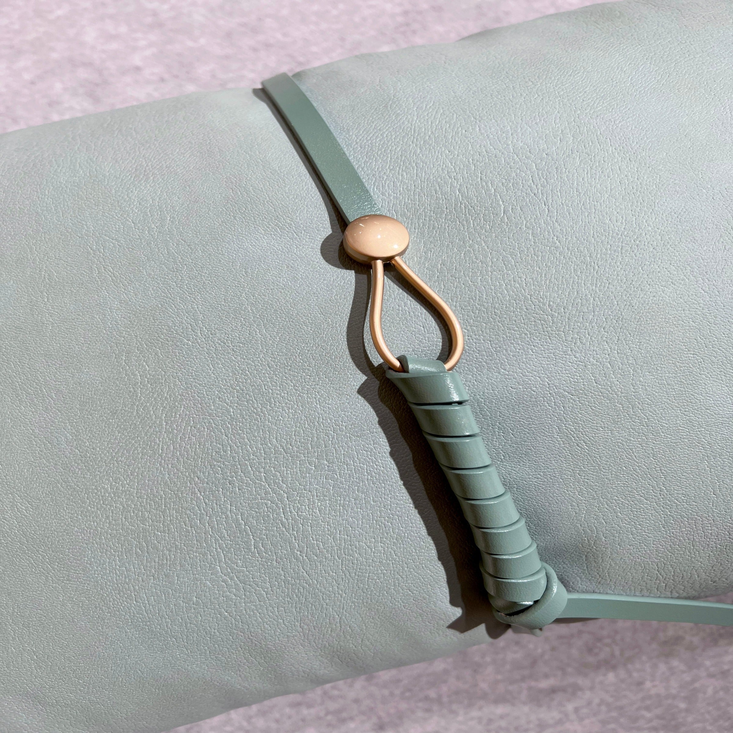 Beige 30x60 Cecil Belt Cushion by BEACON, featuring a soft fabric cover and decorative belt design for modern home decor.