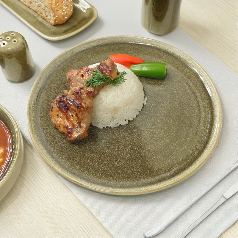 39-piece Browny dinnerware set by BEACON featuring plates, bowls, and mugs in a warm, earthy tone for elegant dining.