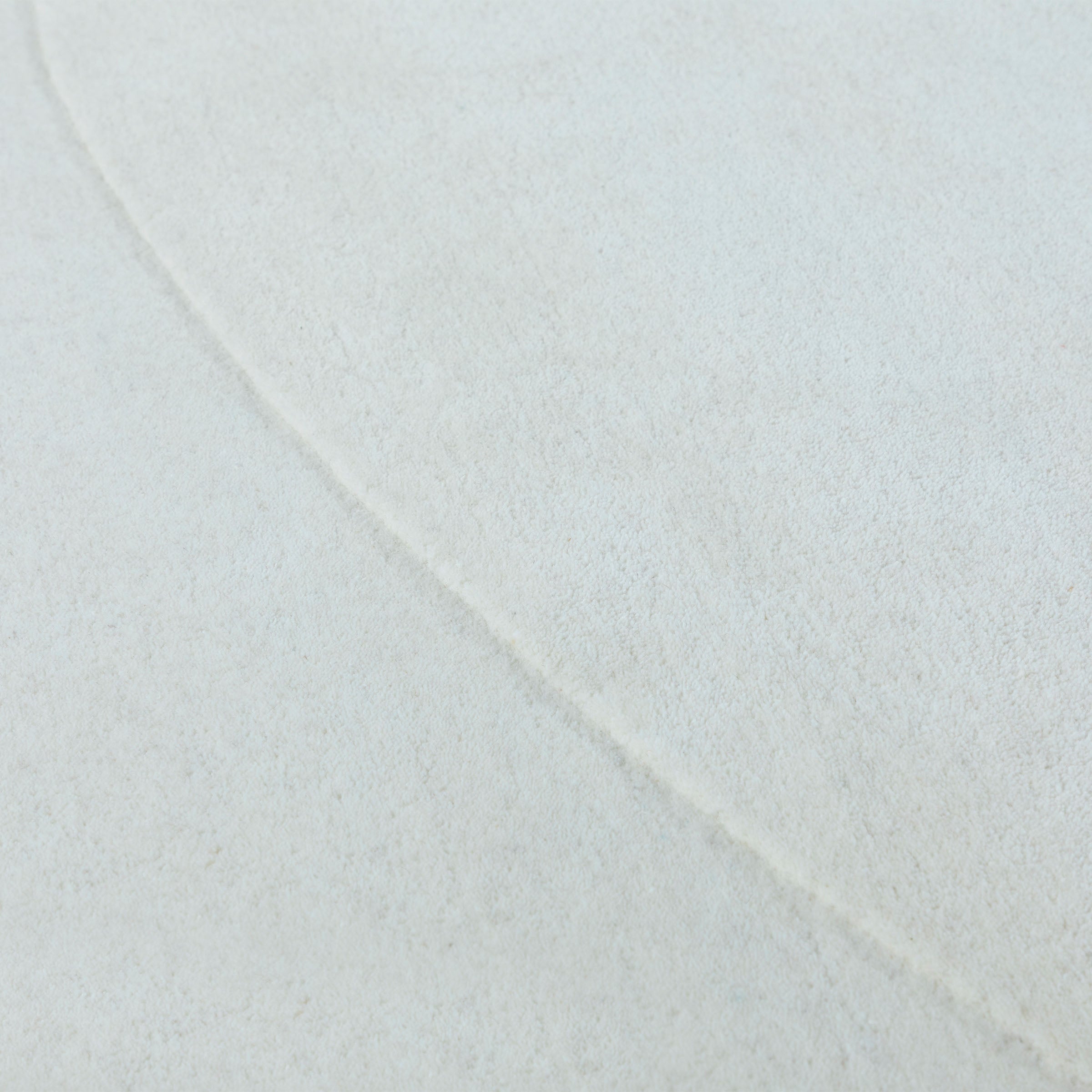 Beige wool rug measuring 450x300 cm from Javi, with soft texture and woven pattern, perfect for living room or bedroom decor.