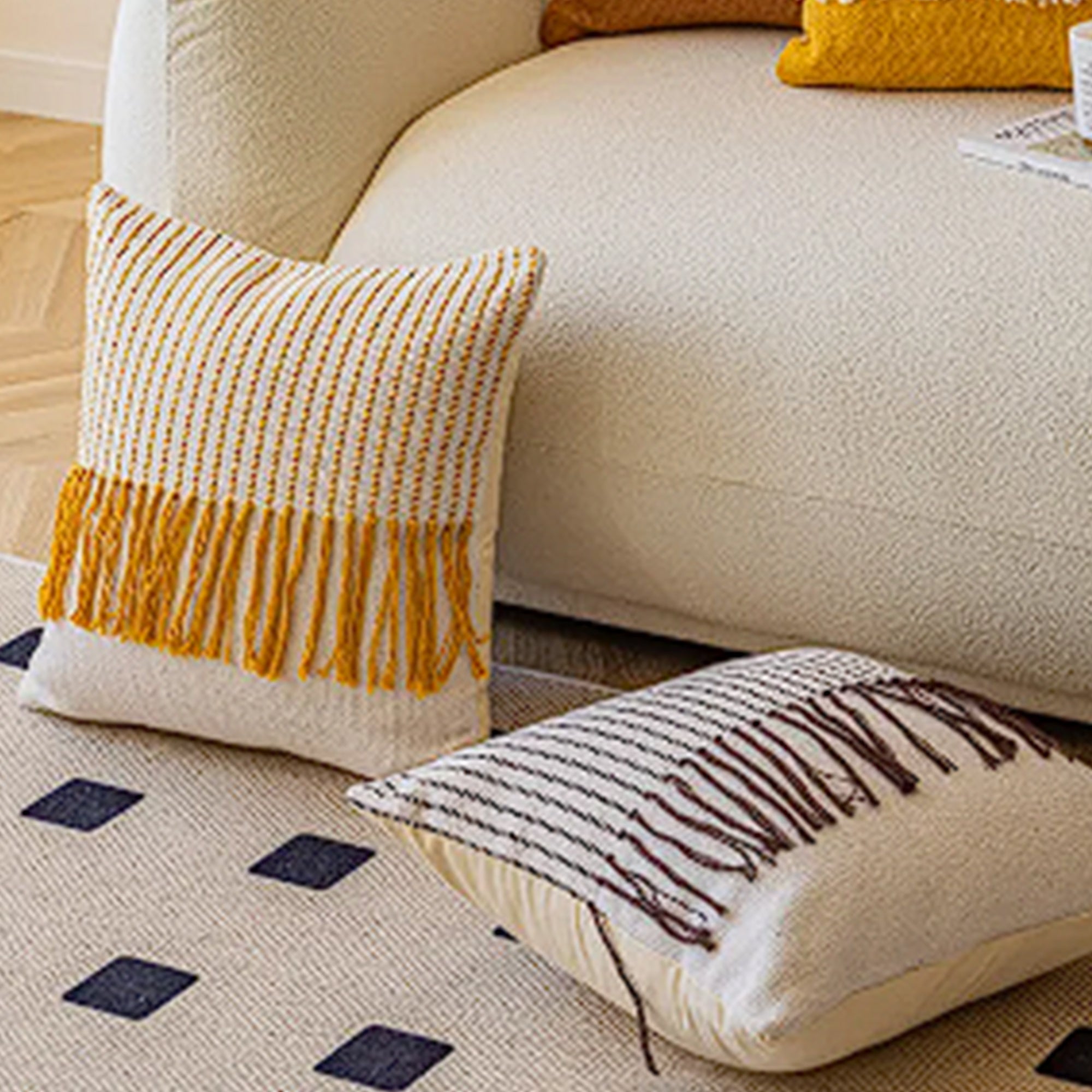 White and brown 45x45 cm tassel cushion by BEACON, featuring decorative tassels and soft fabric for cozy home decor.