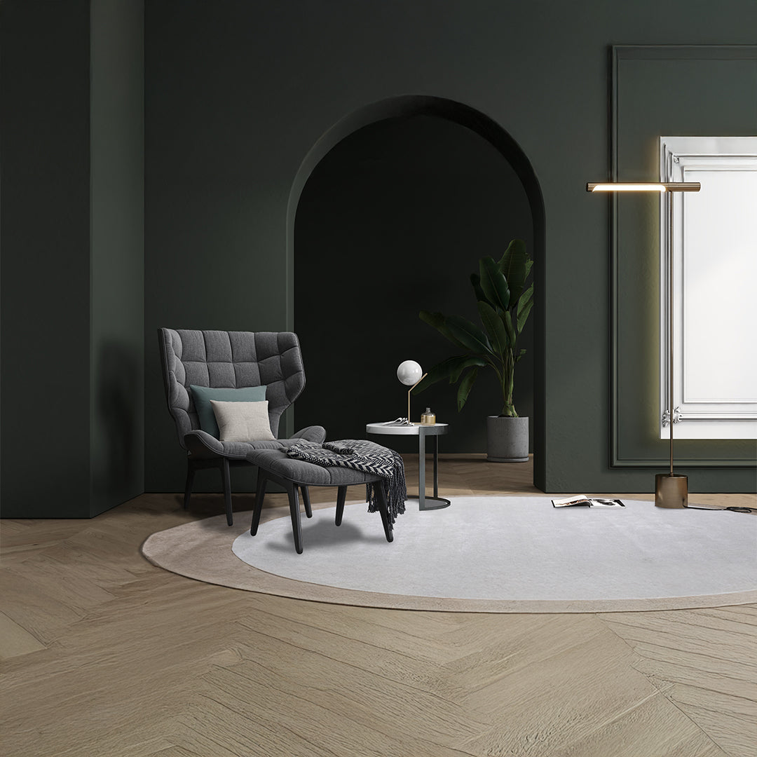 Round wool rug in beige and brown with a 500x350 cm size from Javi, featuring a soft, textured surface and intricate pattern.