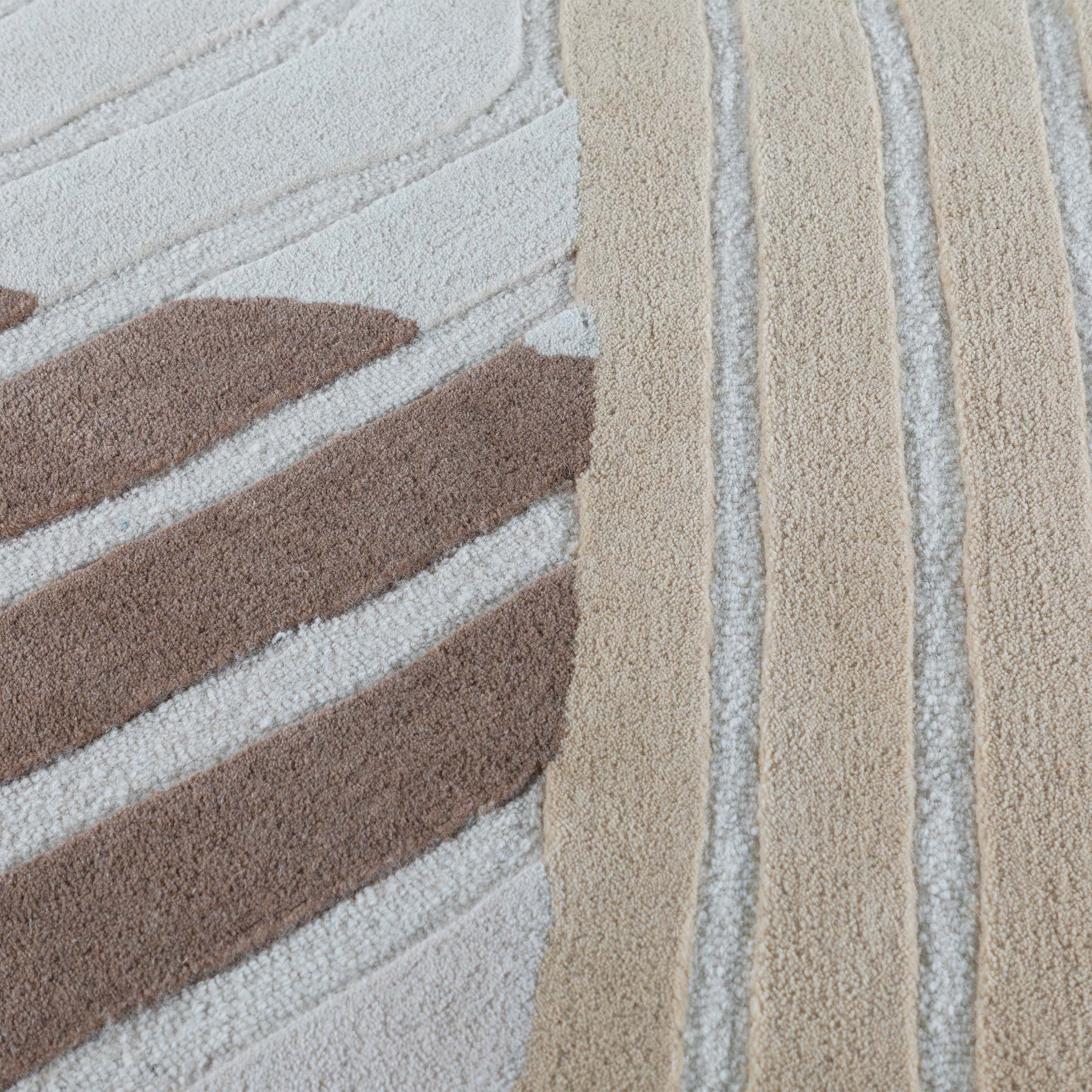 Beige wool rug measuring 600x350 cm from Javi, with soft texture and intricate woven pattern suitable for living rooms or bedrooms.