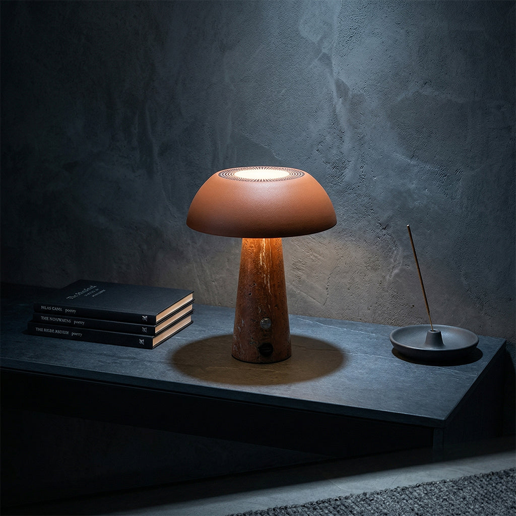 Solis table lamp by BEACON, modern desk lamp with orange finish, featuring a sleek design and adjustable arm for focused lighting.
