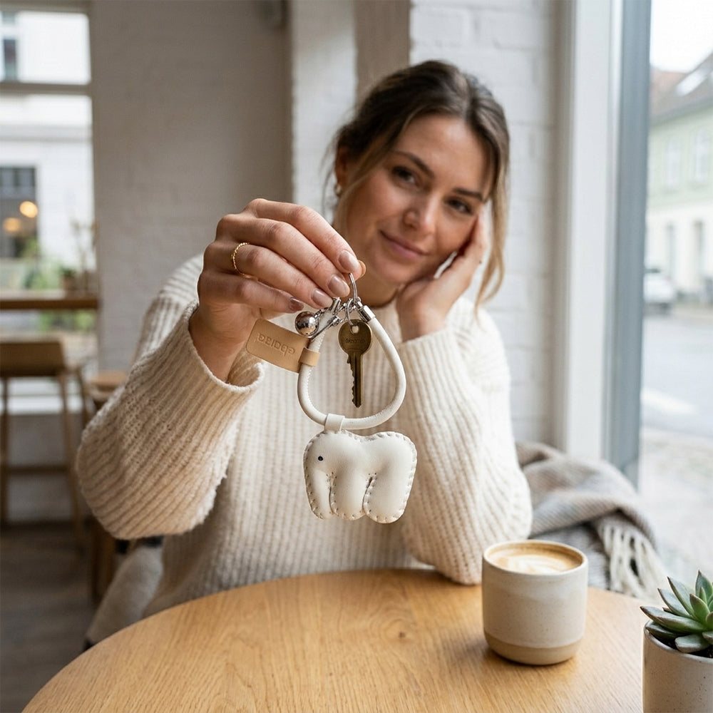 BEACON keychain 010 with a sleek design, featuring the brand logo, attached to a set of keys in the image.