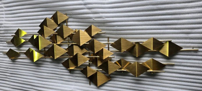 Handcrafted stainless steel artwork titled "The Flock" by Beacon, featuring a detailed display of bird figures in metal art style.