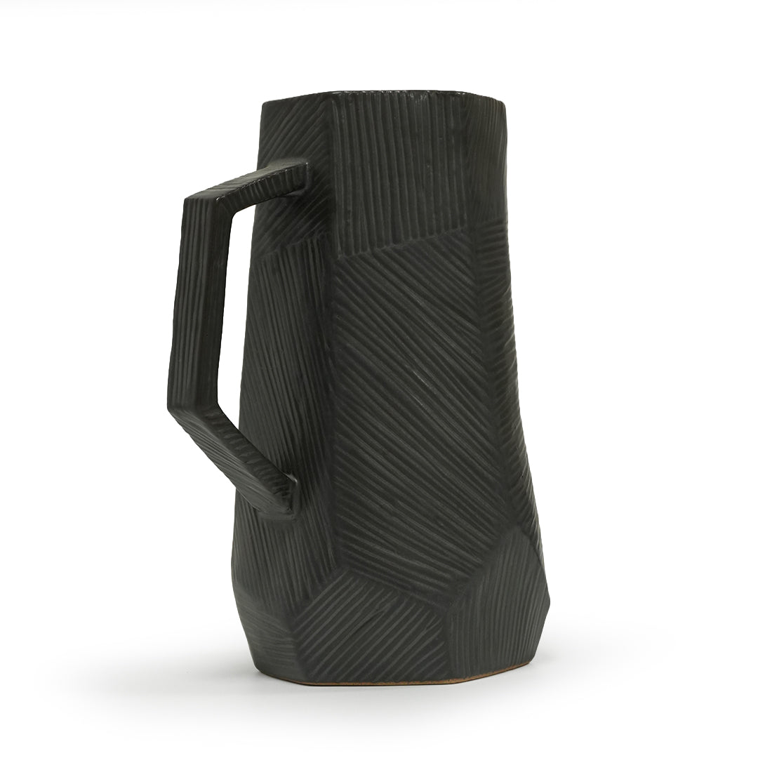 Black volcanic chizzled ceramic jug by Mingxiang Ceramics, elegant black drinkware with textured chizzled design.