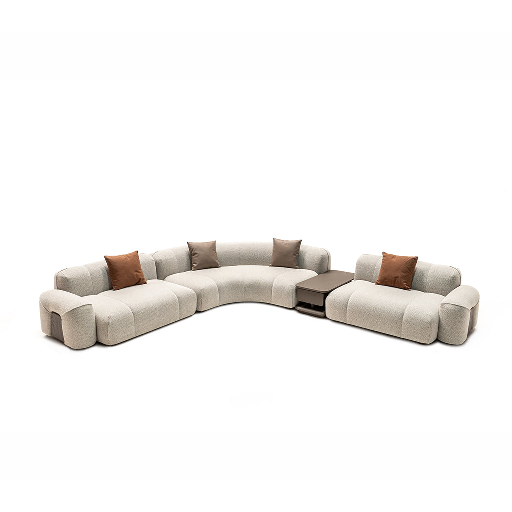 Modern bold corner sofa with matching coffee table by HOMAGE KOLTUK, featuring plush cushions and sleek design.