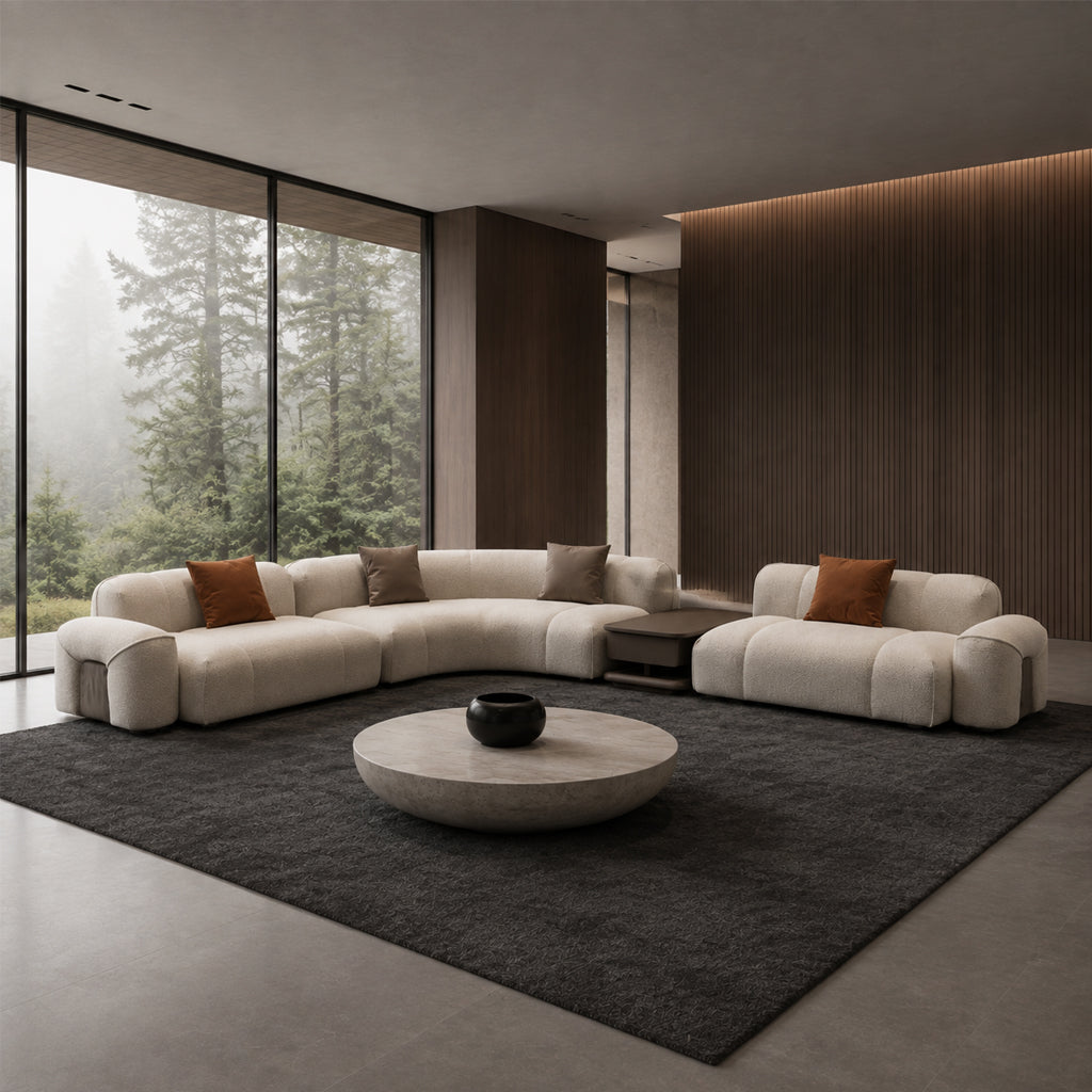Modern bold corner sofa with matching coffee table by HOMAGE KOLTUK, featuring plush seating and contemporary design.