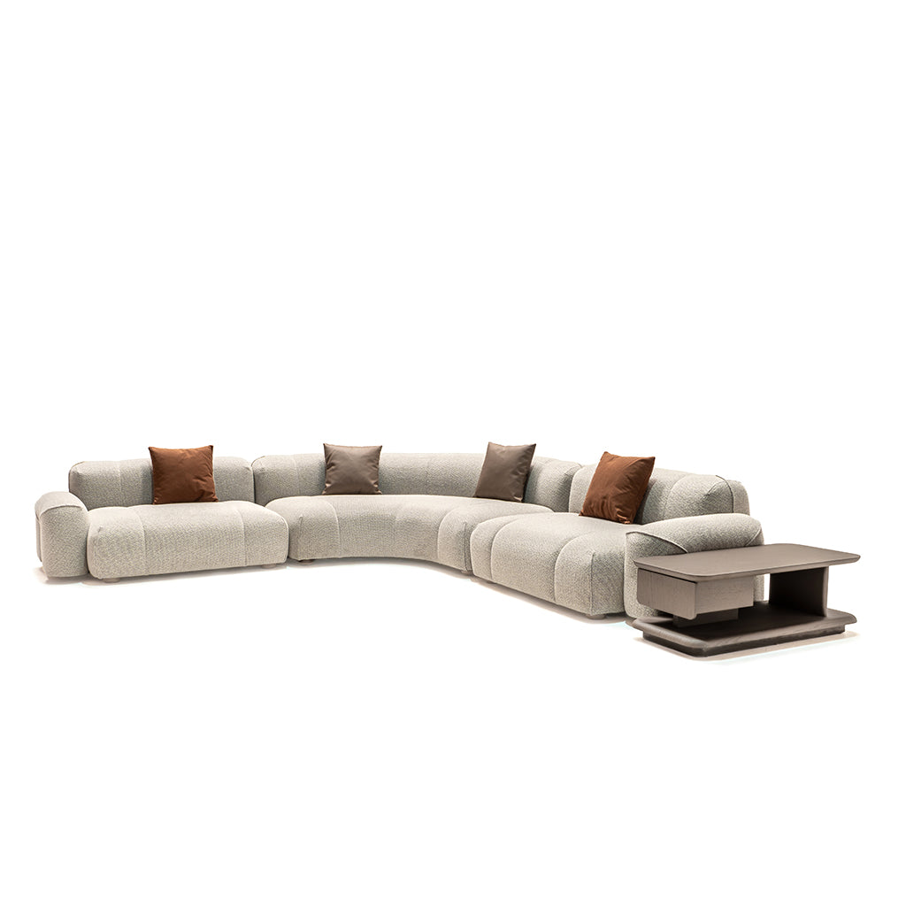 Bold corner sofa with matching coffee table by HOMAGE KOLTUK, featuring plush cushions and modern design in a living room setting.