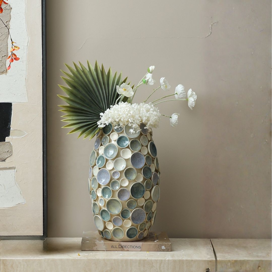 Colorful round handmade ceramic vase with glossy glaze, vibrant colors, and a smooth finish, designed by BEACON.