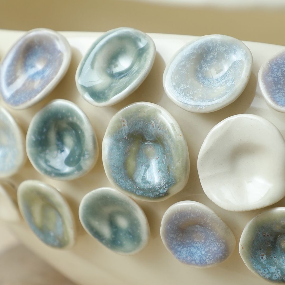 Colorful round glazed handmade ceramic bowl by BEACON, featuring vibrant patterns and a smooth glossy finish.