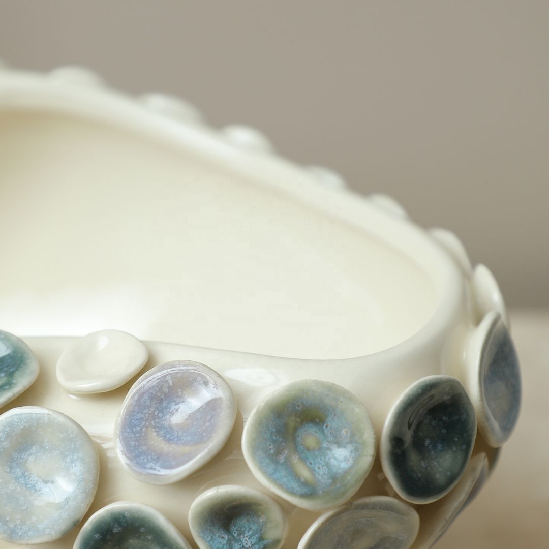 Colorful round glazed handmade ceramic bowl by BEACON, showcasing vibrant colors and intricate design.