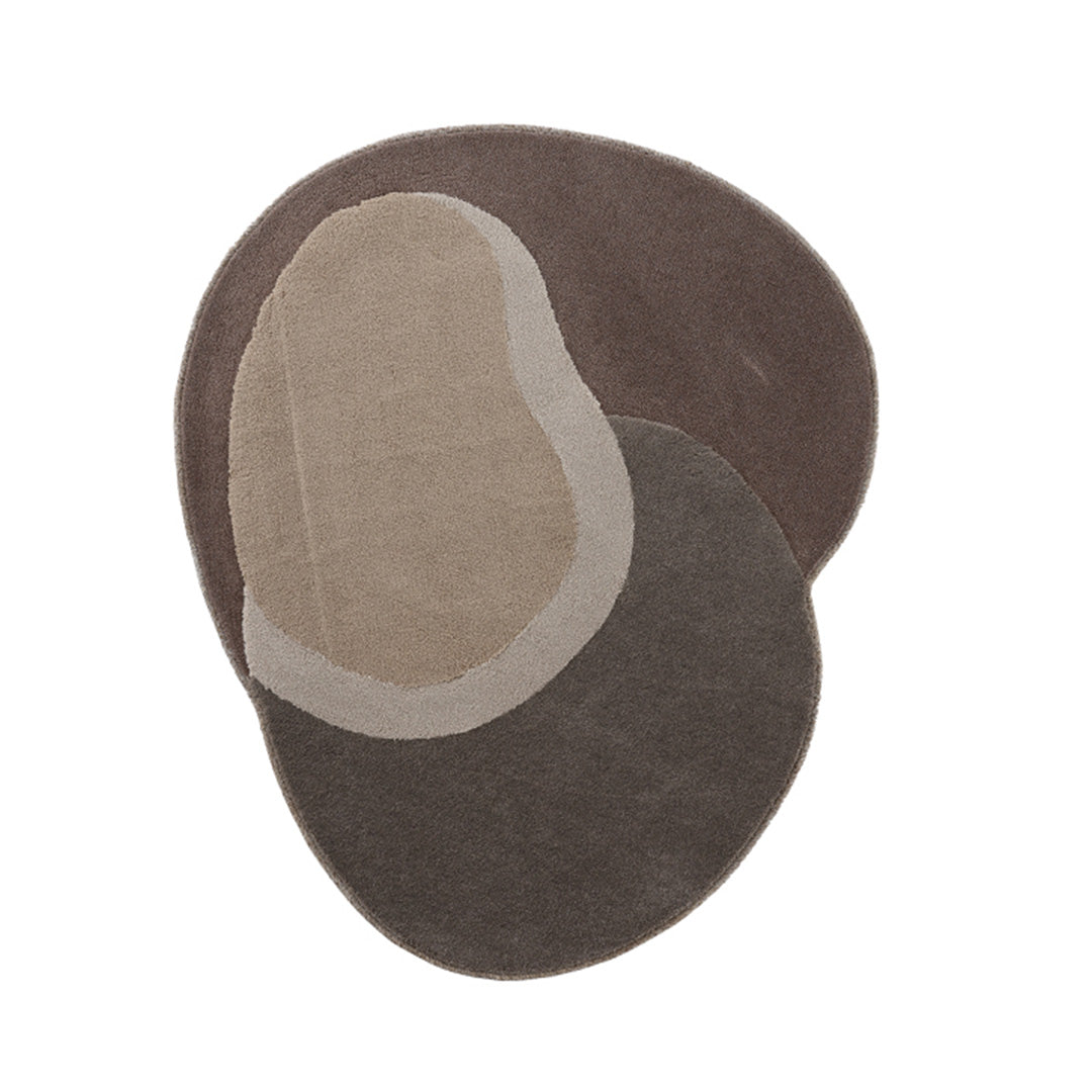 Handmade round rug by COOL HALI, 575x470 cm DUNE-01 with earthy brown tones and textured woven design.