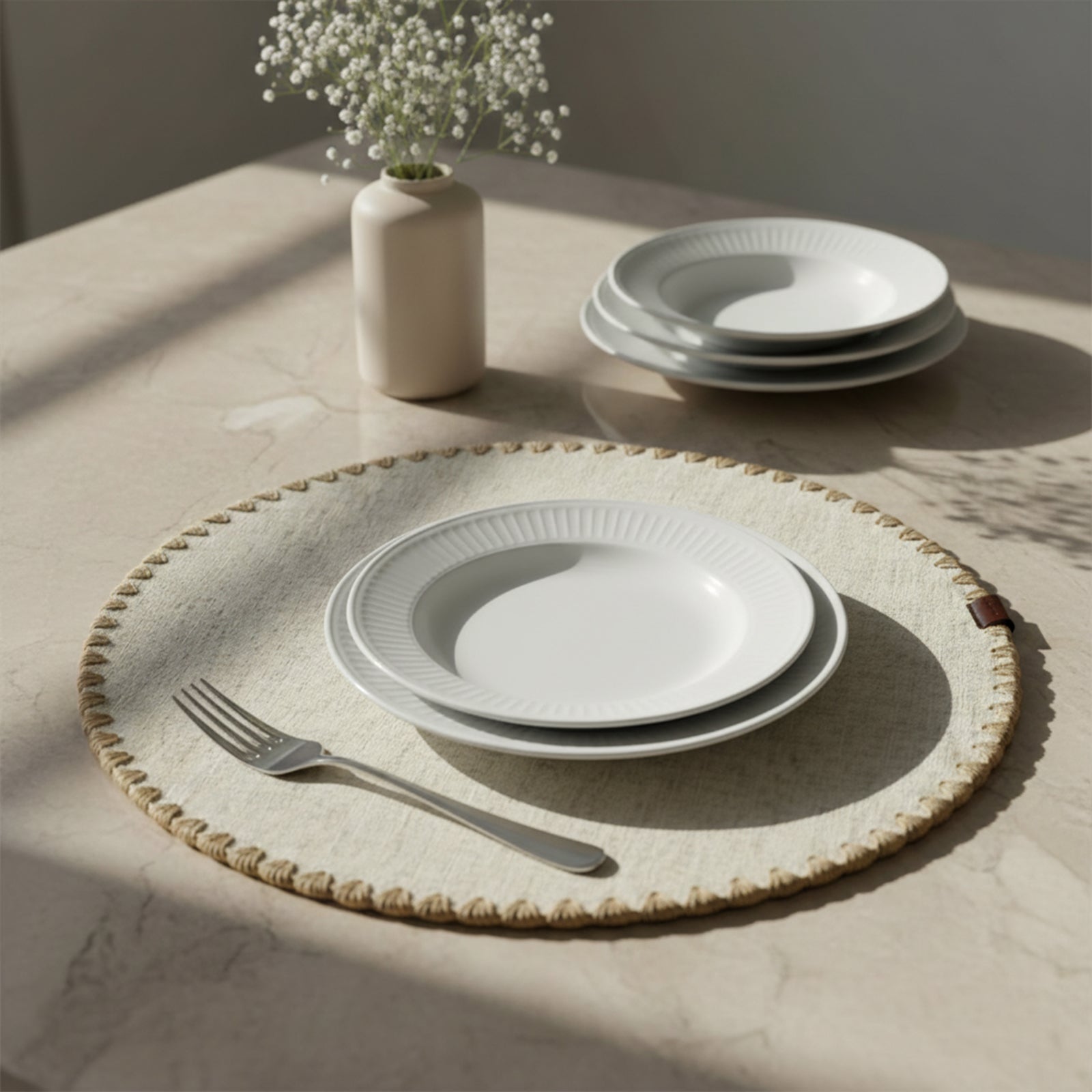 Beige Dineva placemat with shelled edge and double-layer design, showcasing its textured surface and elegant style.