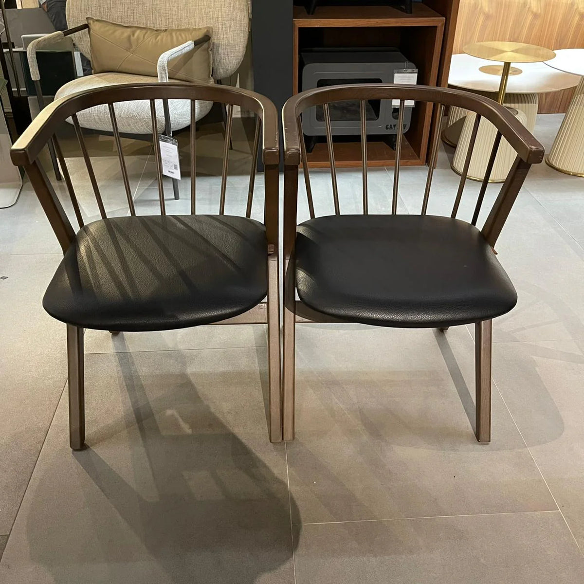 Display image of the Linz Craft Chair Mone-034 by SANCREA, featuring a modern wooden design with a curved backrest.