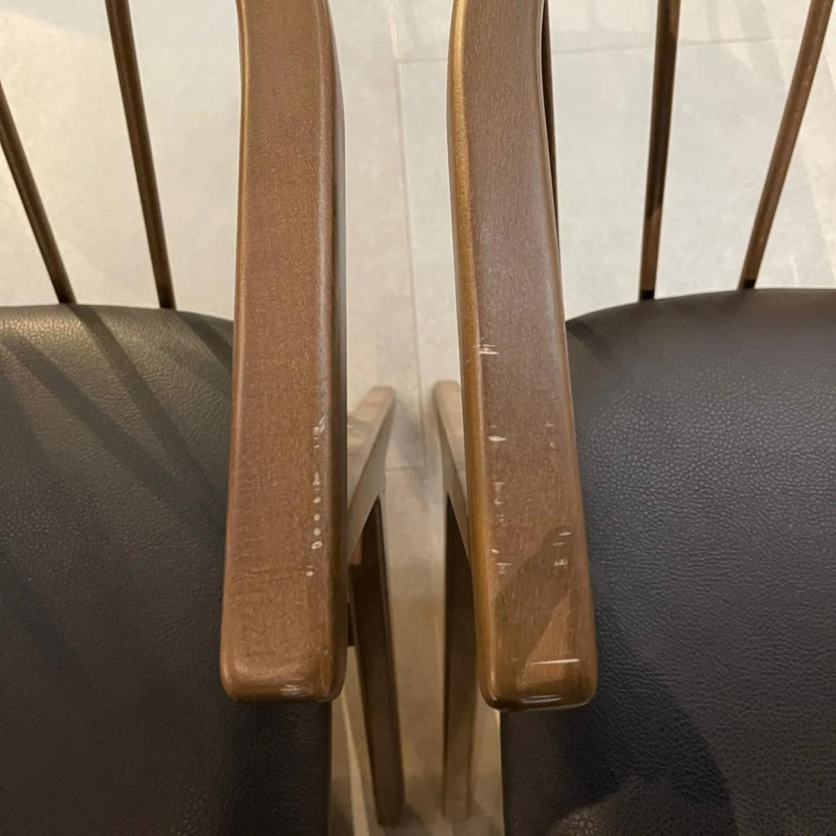 Display of the Linz Craft Chair Mone-034 by SANCREA, showcasing its modern design and wooden legs on a neutral background.