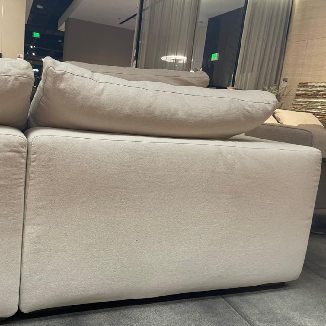 Display of BEACON CHAM 2-Seater Sofa in natural fabric with plush cushions, showcasing modern living room furniture design.