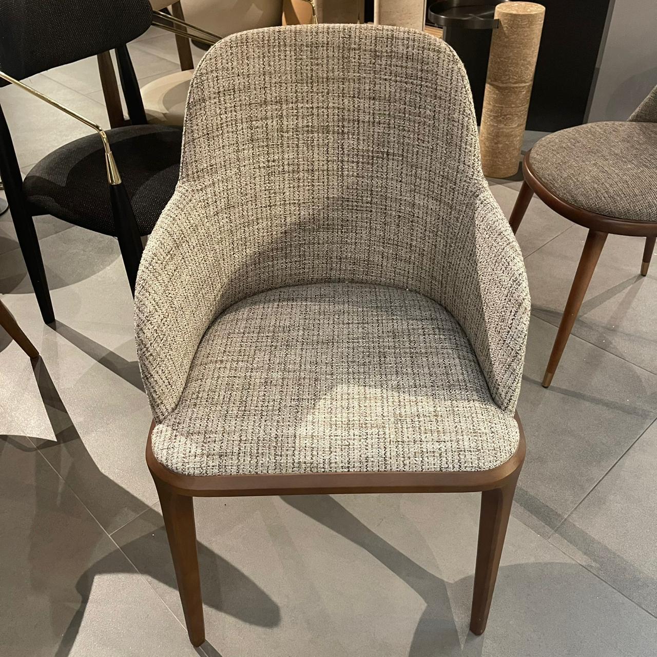 Display image of YOL LIVING Genova dining chair with armrest, showcasing modern design and sturdy construction.