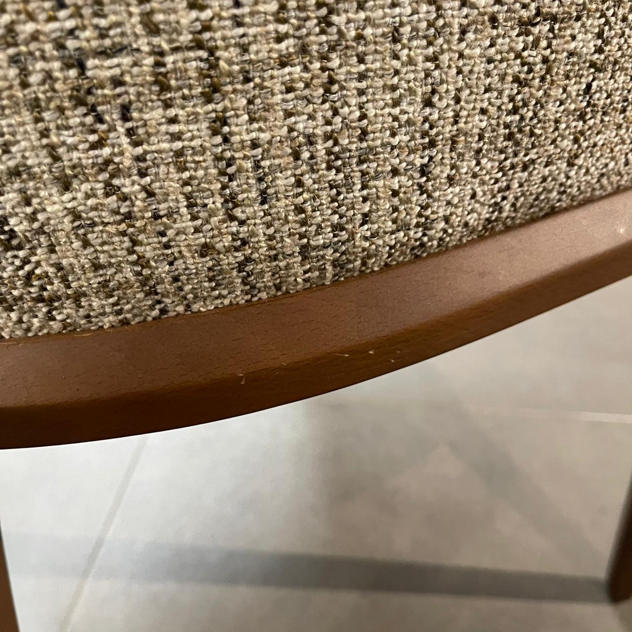 Display YOL Living Genova dining chair with armrest, showcasing its modern design and wooden frame on a neutral background.