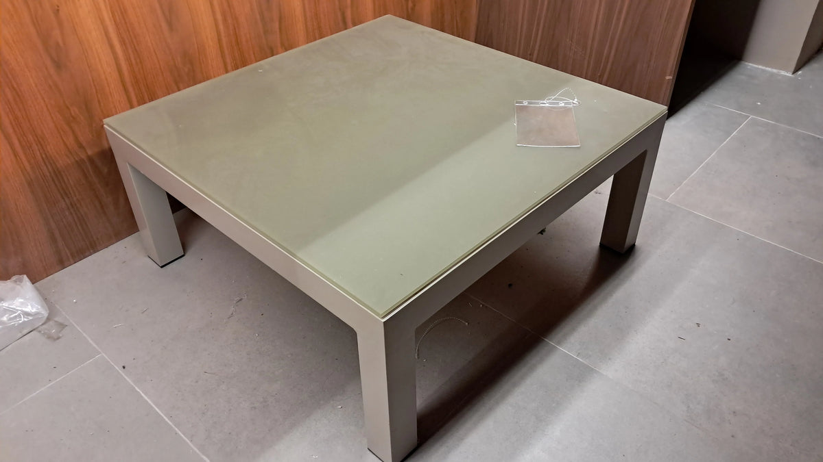 Display of the Lyon outdoor center table by Beacon, showcasing the sturdy tabletop and modern design in a retail display setting.