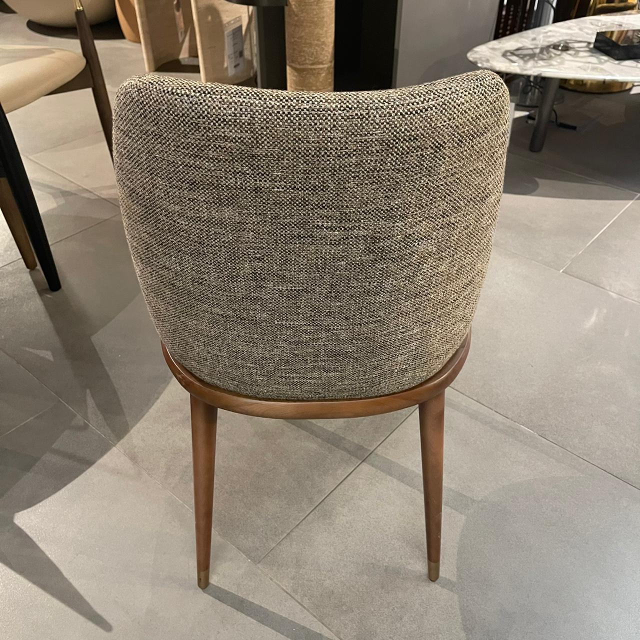 YOL Living Pena dining chair display model with wooden legs and upholstered seat, modern design.