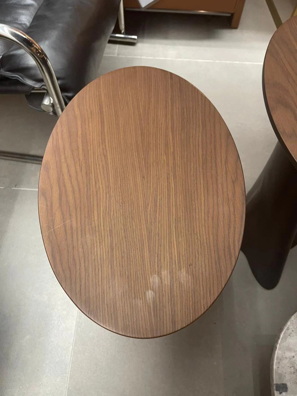 Set of two Guzzi side tables by TOGO HOME STYLE, featuring modern design with wooden tops and metal legs.