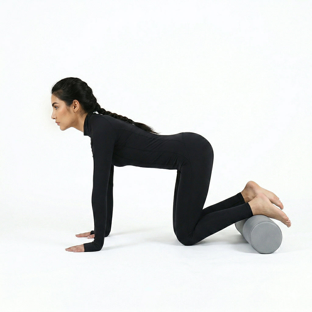 A BEACON Epp Foam Leather Foam Roller for gym workouts, cylindrical shape with a smooth leather-like surface, used for muscle relief.