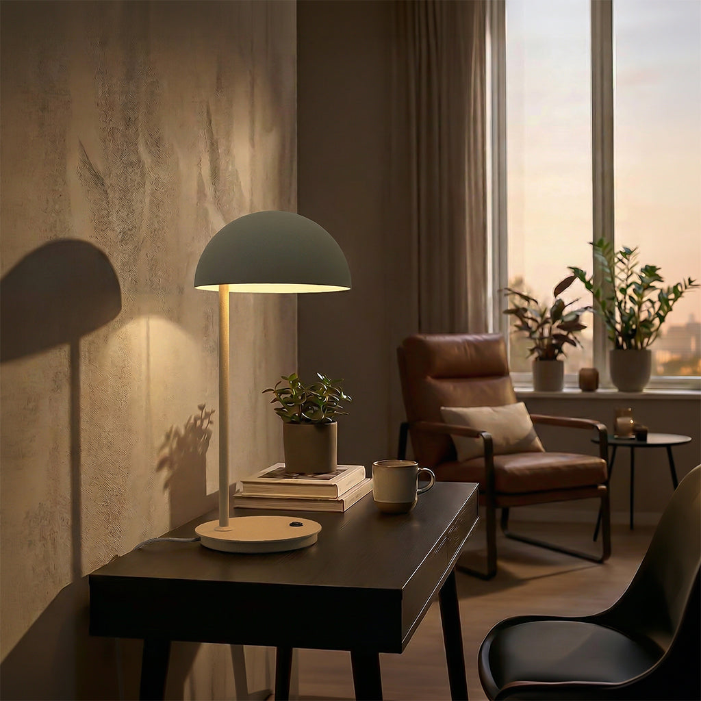 BEACON Eris table lamp with sleek modern design, adjustable arm, and warm light for desk or table lighting.