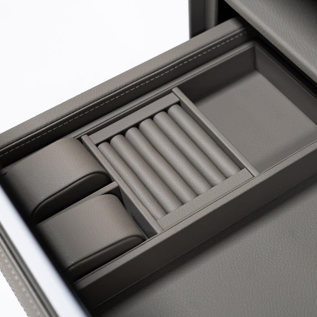 Fingerprint safe box with built-in watch winder holding three watches, secure storage by BEACON with biometric access.