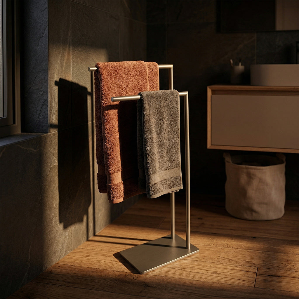 BEACON L-Vertex gunmetal floor towel rack with multiple hooks for hanging towels in a modern bathroom setting.