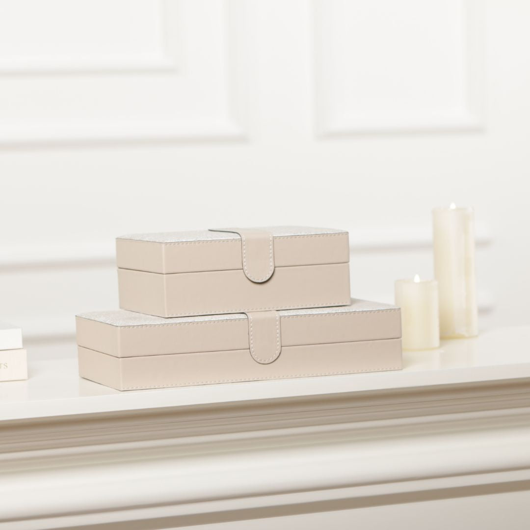 Decorative hinged leather jewelry box by BEACON, featuring a stylish design and secure hinged lid for storing jewelry.