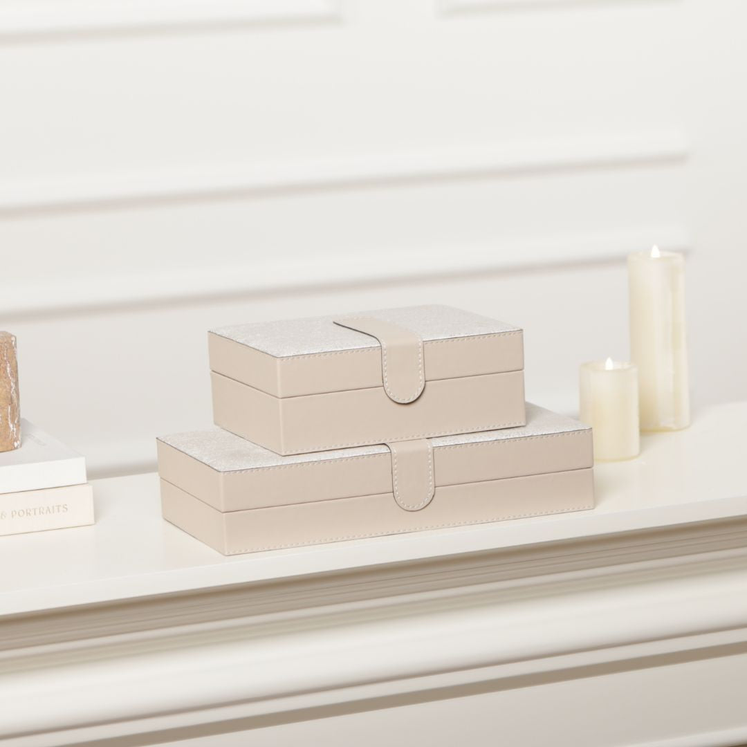 Hinged leather jewelry box by BEACON with decorative design, featuring compartments for storing jewelry and accessories.