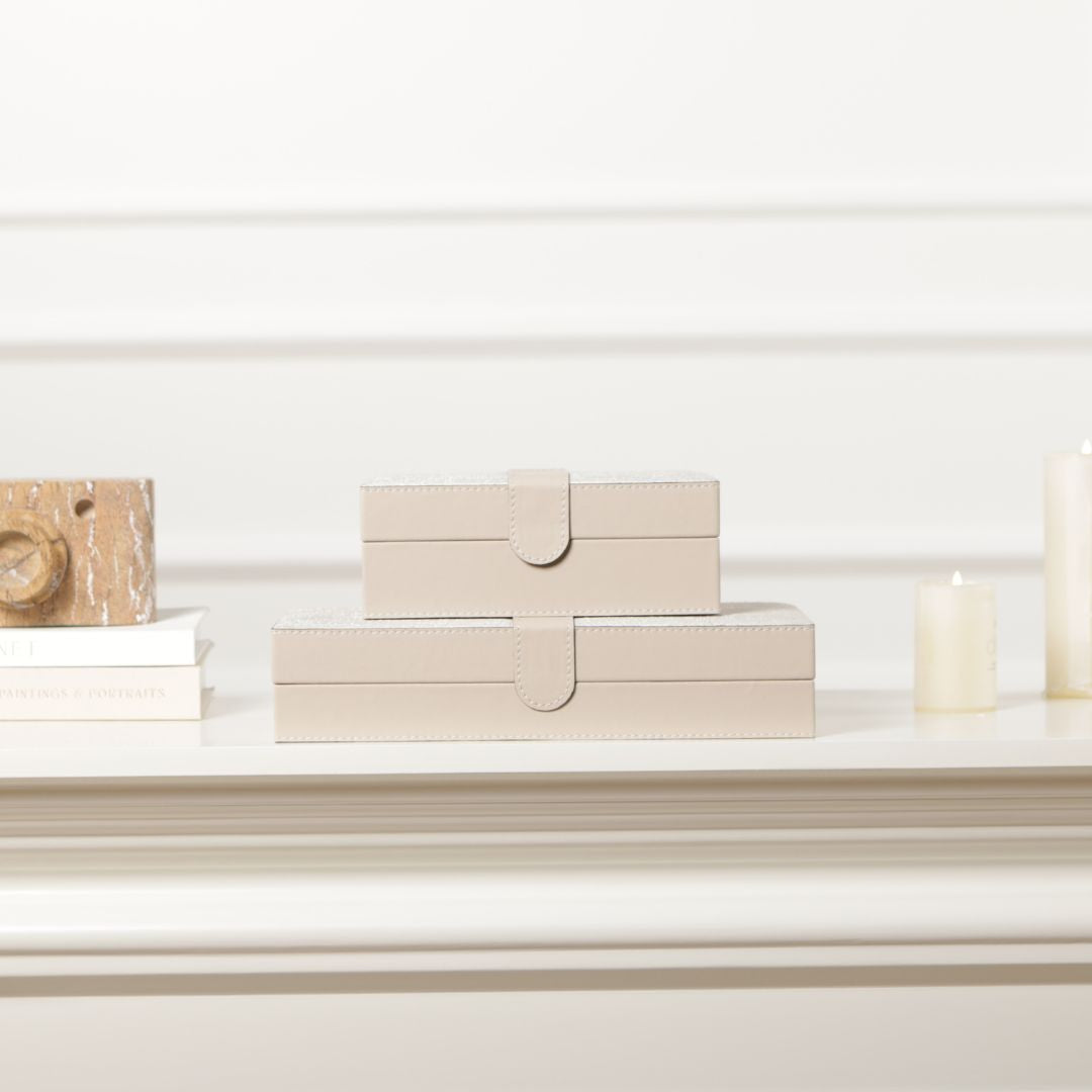Hinged leather jewelry box by BEACON, decorative box with a smooth leather finish and interior compartments for jewelry storage.