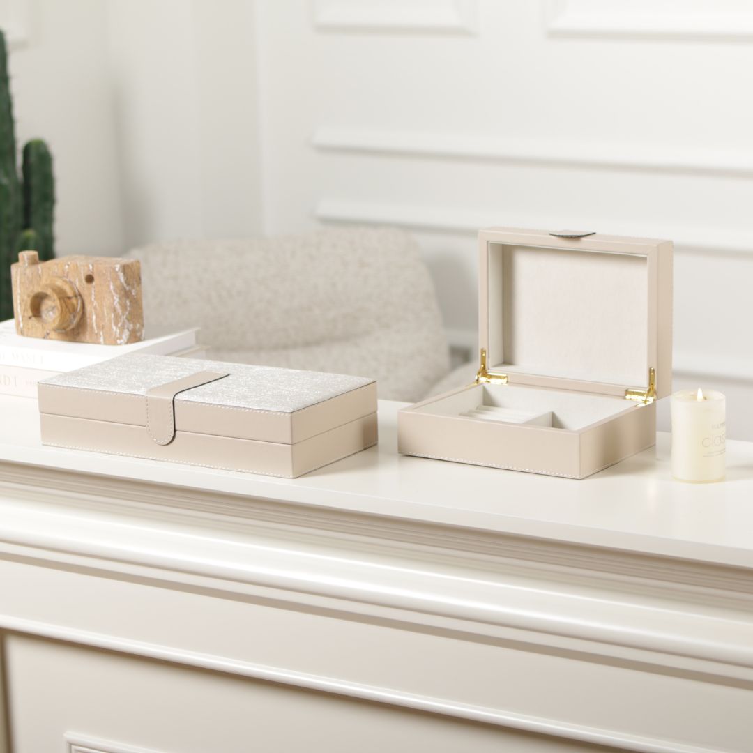 Hinged leather jewelry box by BEACON, decorative box with a smooth leather finish and interior compartments for jewelry storage.