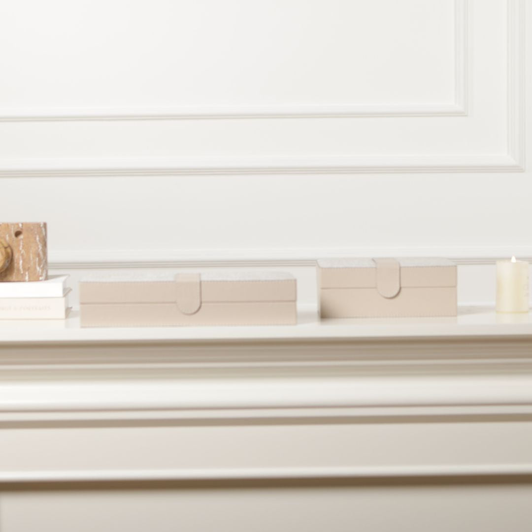 Decorative hinged leather jewelry box by BEACON with a smooth texture, featuring compartments for storing jewelry accessories.