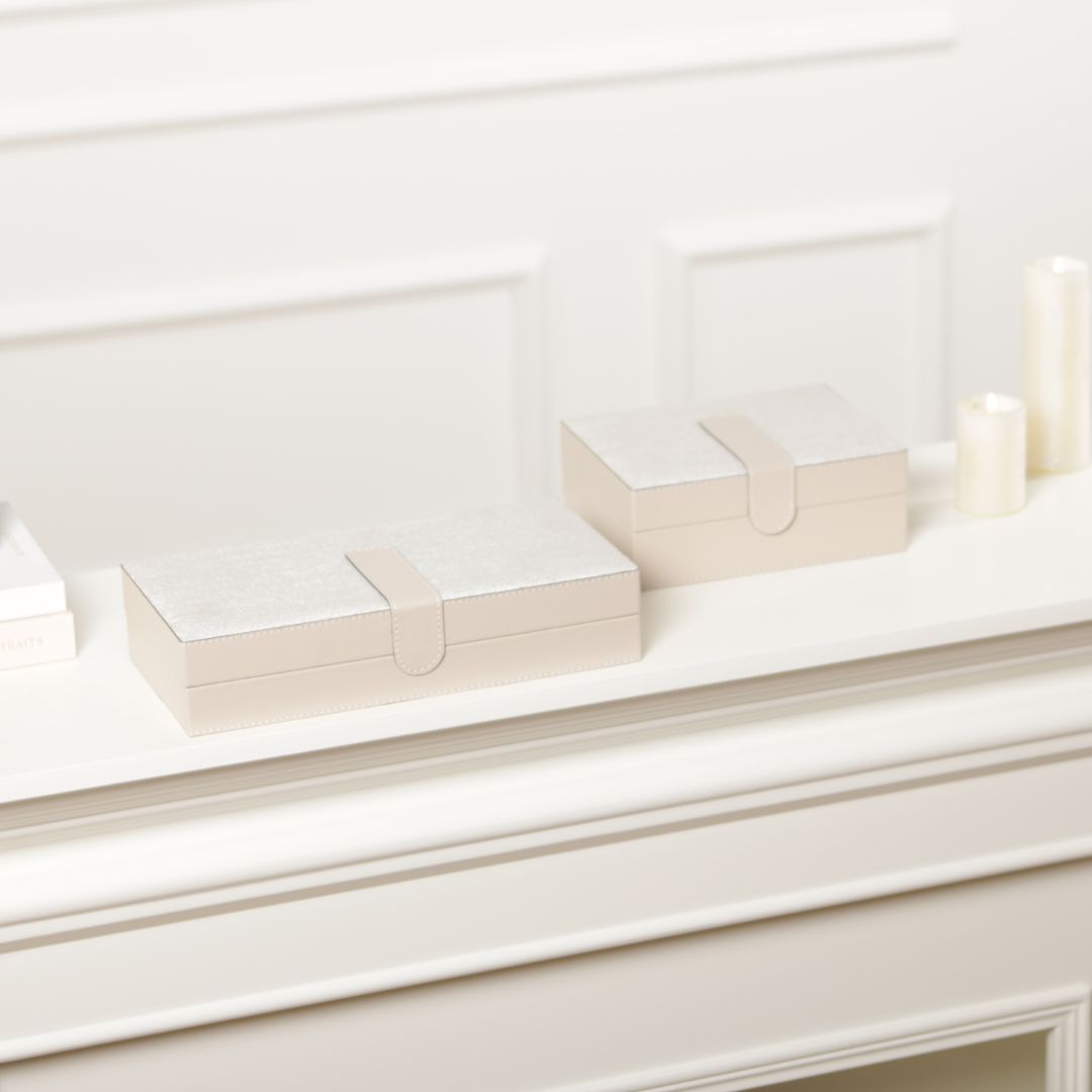 Hinged leather jewellery box by BEACON featuring a decorative design with compartments for organizing jewelry.