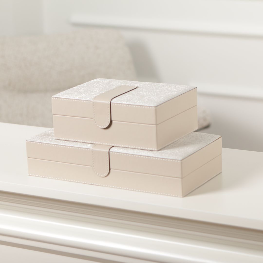 Decorative hinged leather jewelry box by BEACON with a smooth brown finish and brass clasp for elegant storage.