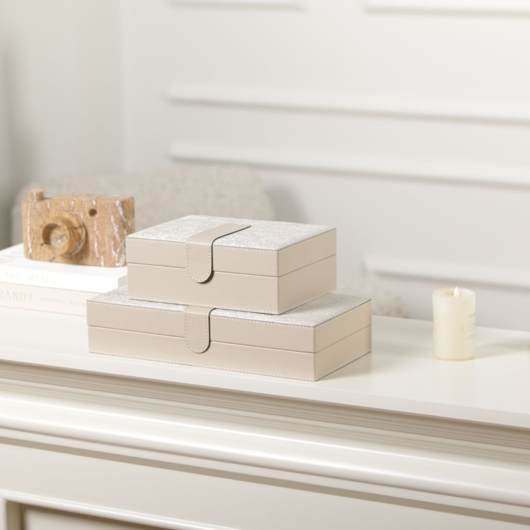 Hinged leather jewelry box by BEACON with decorative design, featuring a smooth leather surface and elegant hinged lid.