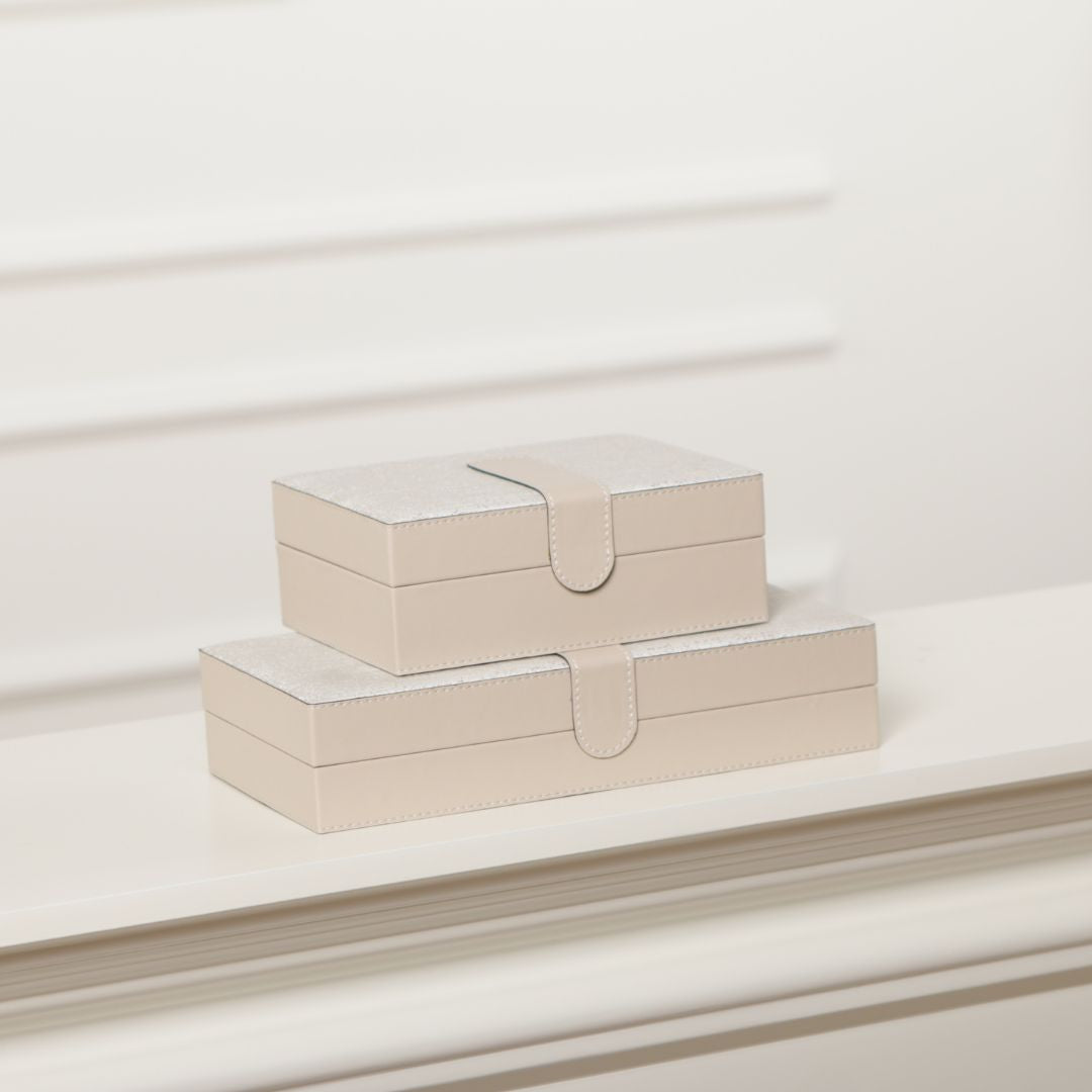 Decorative hinged leather jewelry box by BEACON, featuring a sleek design and secure clasp for storing jewelry and accessories.