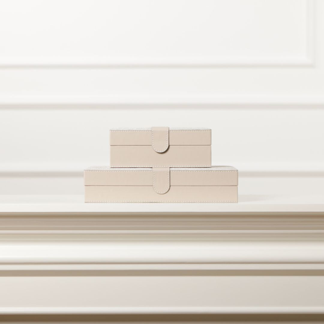 Decorative hinged leather jewellery box by BEACON, featuring a sleek design and interior compartments for jewelry storage.