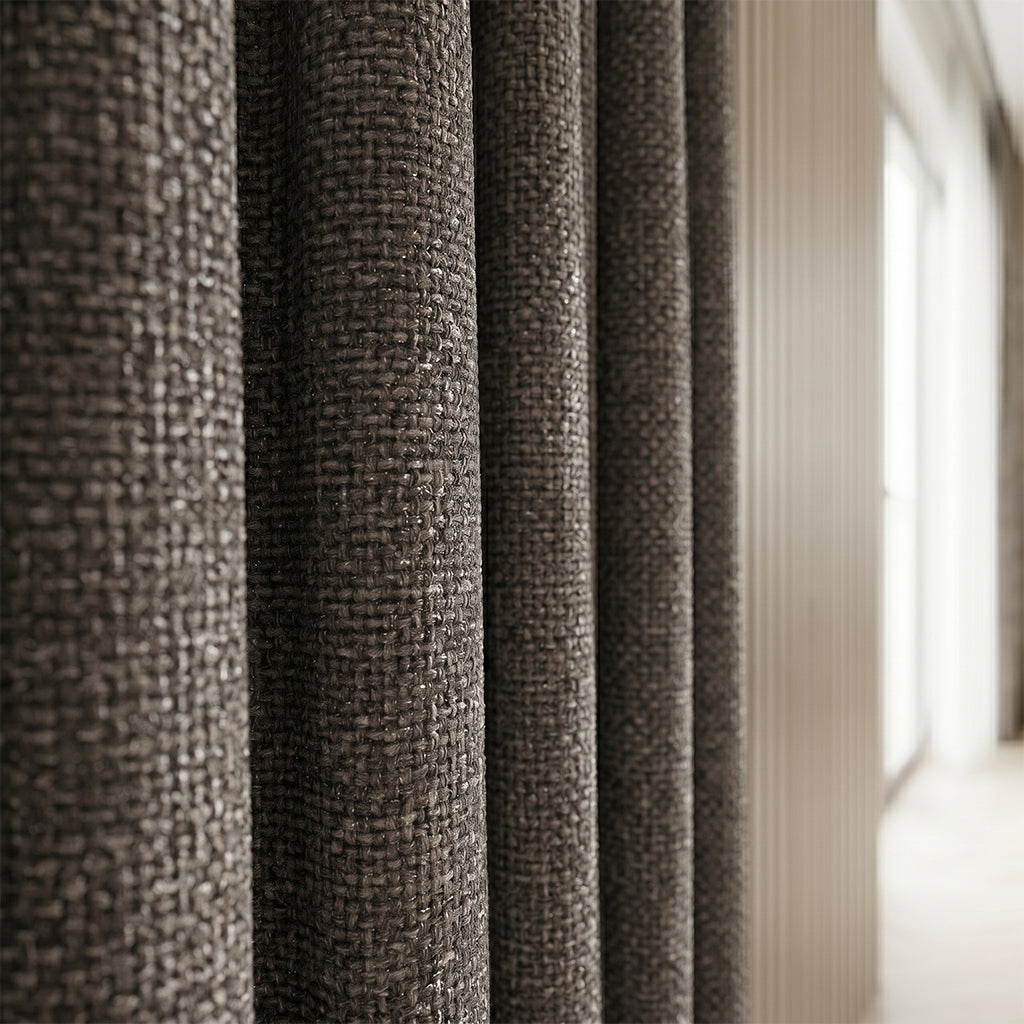 Beige polyester curtain fabric by BEACON, shown in a close-up with soft texture and subtle pattern for curtains and drapes.