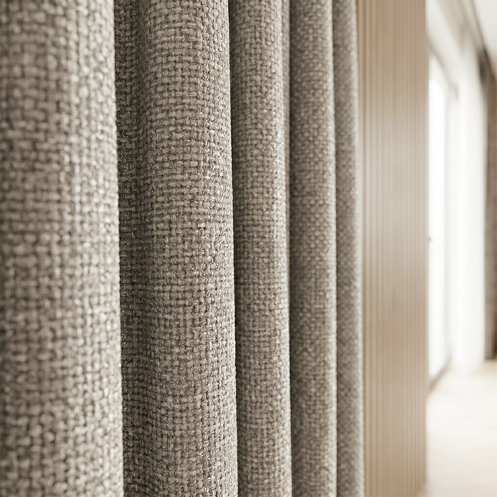 Beige polyester curtain fabric by BEACON, featuring a soft texture and subtle pattern, ideal for curtains and drapes.