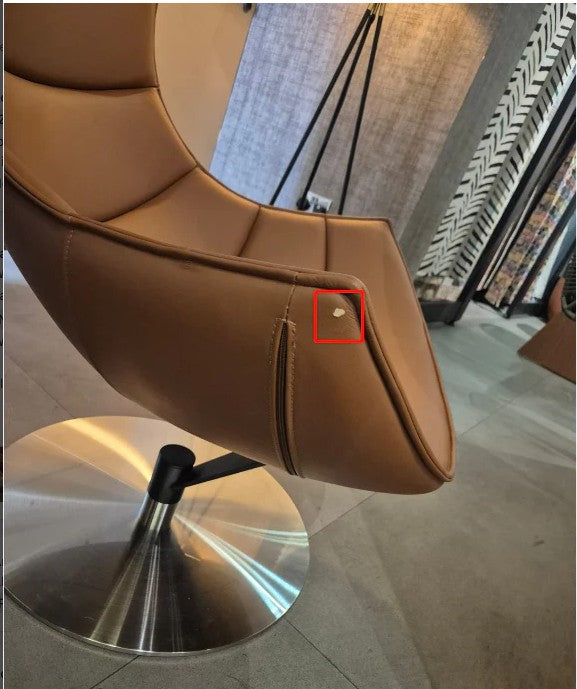 Display of a Jiatai swivel lounge chair in clay color, by Beacon, showcased on a modern display stand.